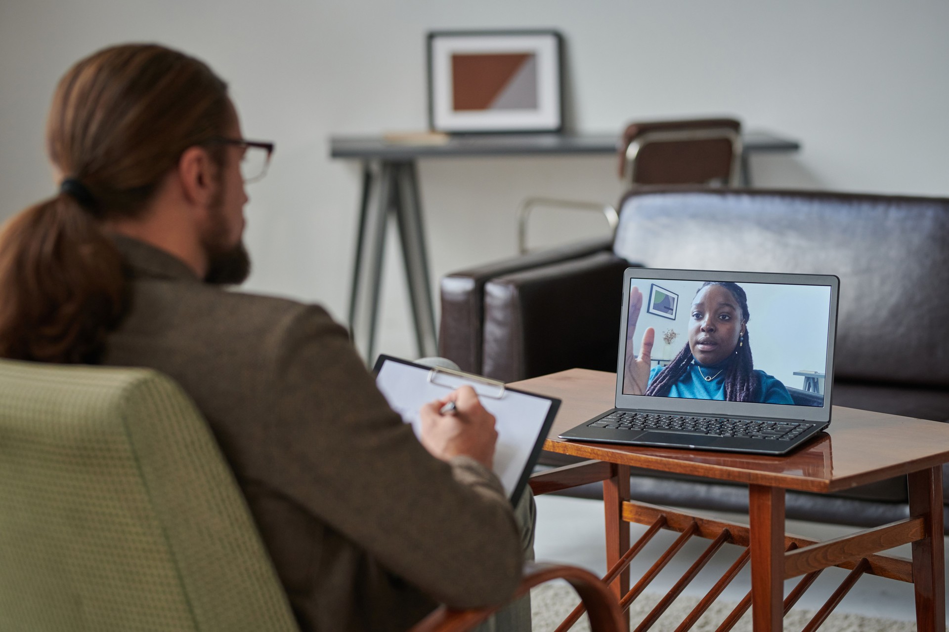 Online consultation on laptop with psychologist